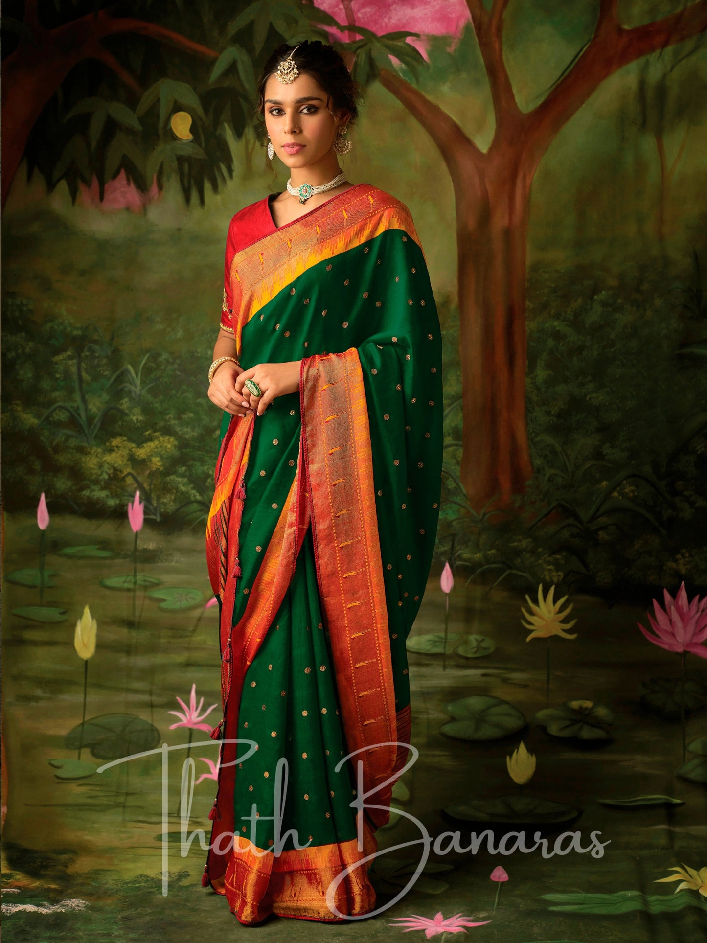 Deep green and red Paithani saree with designer blouse