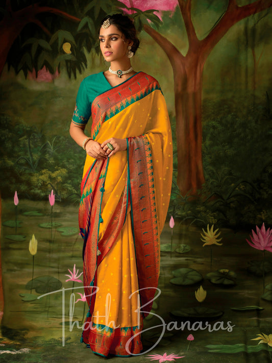 Mustard yellow and red Paithani saree with designer blous