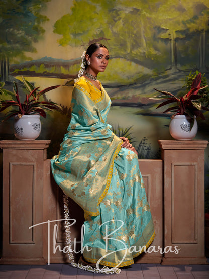 Aqua Blue Pure Dola Silk with Fancy Lace Border and Embroidery Worked Blouse