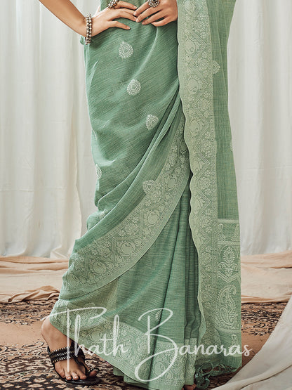 Turquoise green soft luckhnowi rich pallu linen saree.