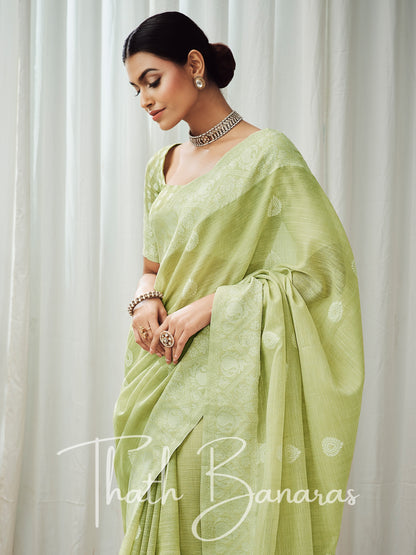 Lemon green soft luckhnowi rich pallu linen saree.