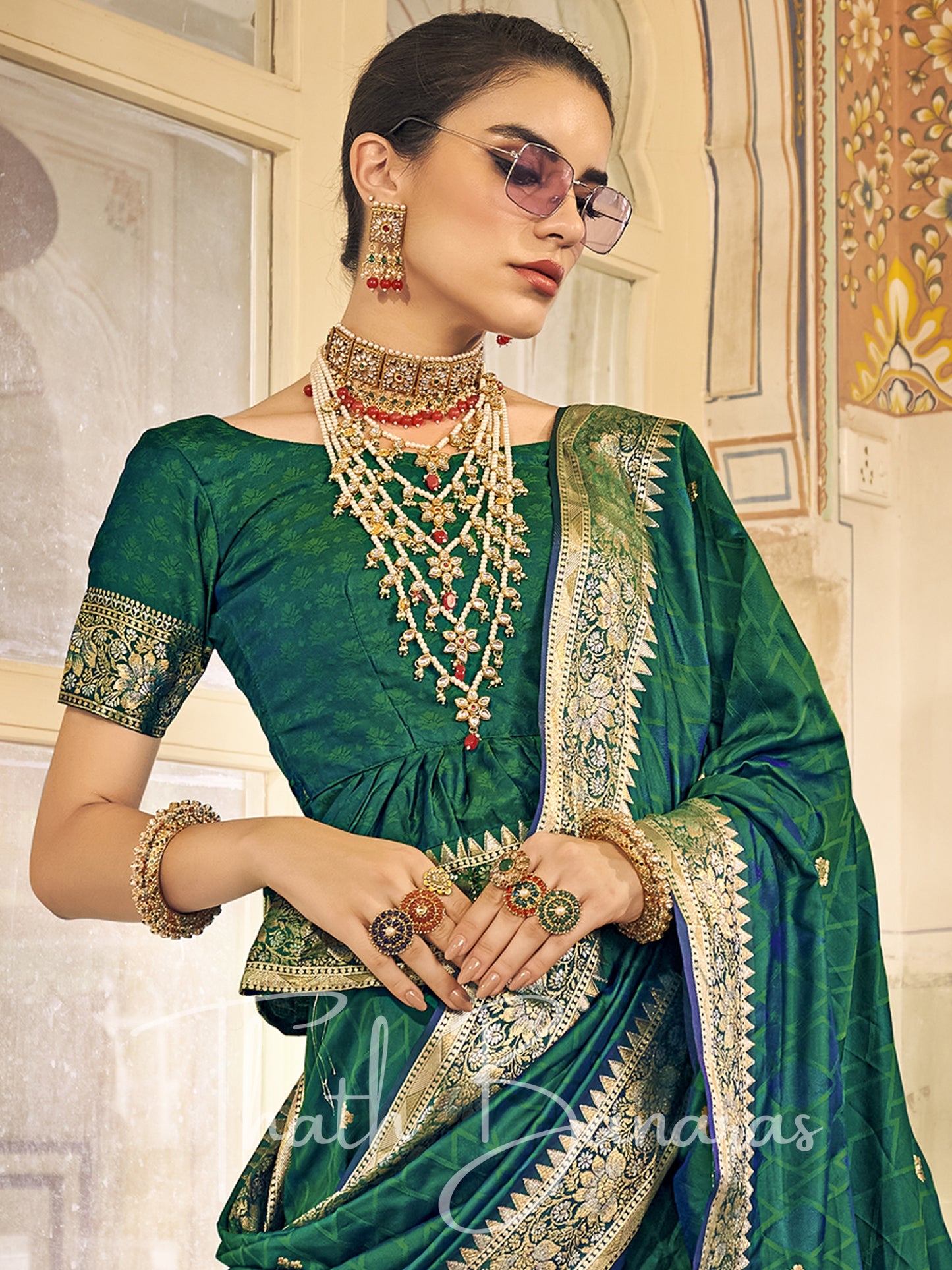 Bottle green Kanchipuram Silk Saree with gold ethnic motifs zari border