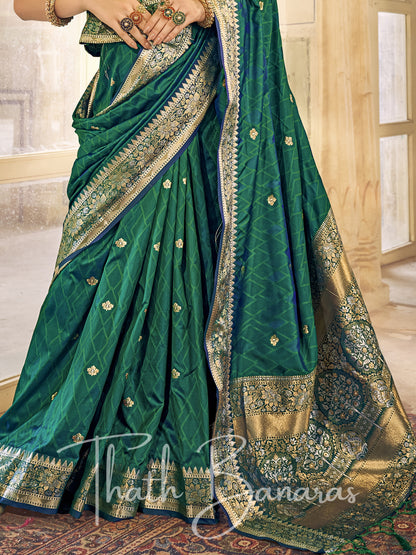 Bottle green Kanchipuram Silk Saree with gold ethnic motifs zari border