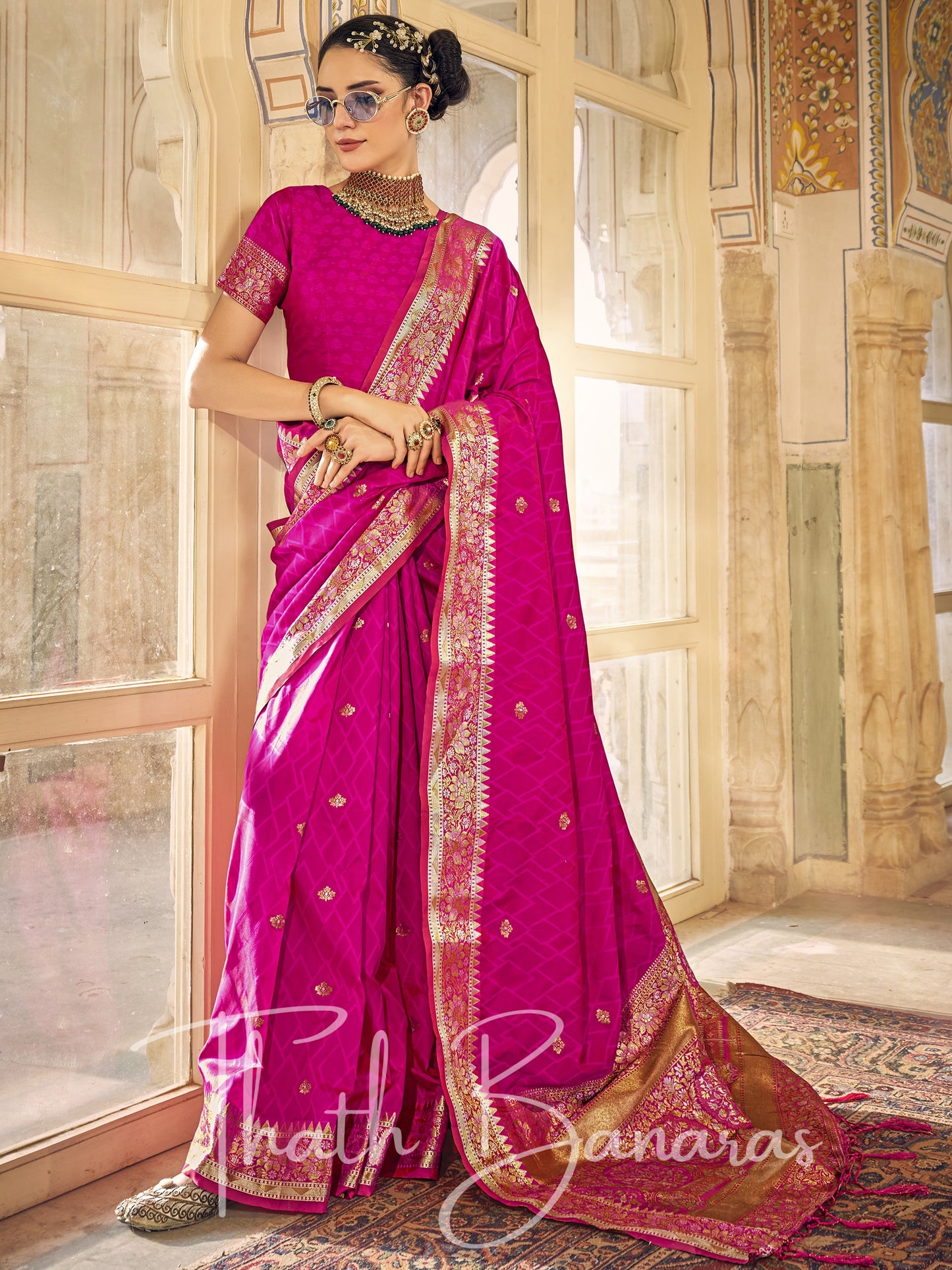 Fuchsia pink Kanchipuram Silk Saree with gold ethnic motifs zari border